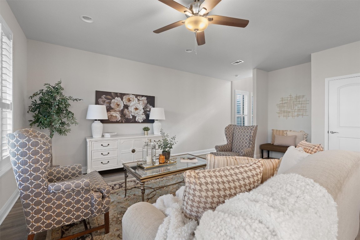 10502 Turnbull Loop, Unit 41 Austin, TX 78717 - Photo 6 of 29 Living room with LVP floors and ceiling fan