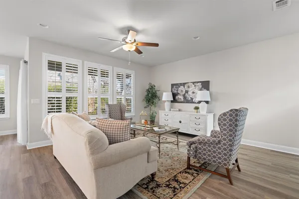 a living room with furniture and a table