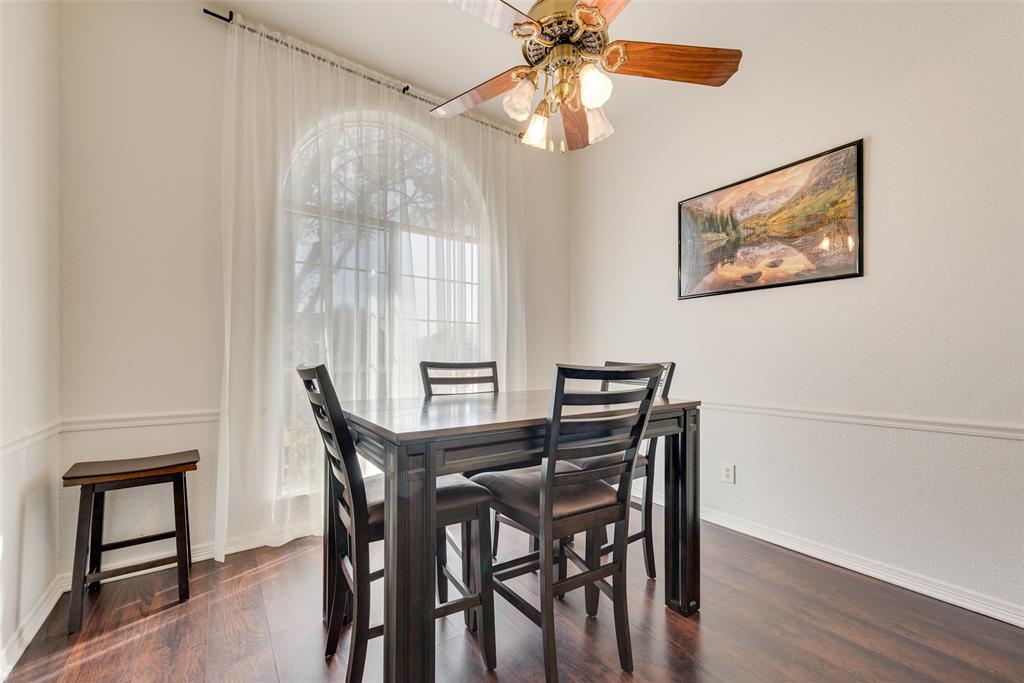 106 Villanova Circle Forney, TX 75126 - Photo 8 of 26 a view of a dining room with furniture window and wooden floor
