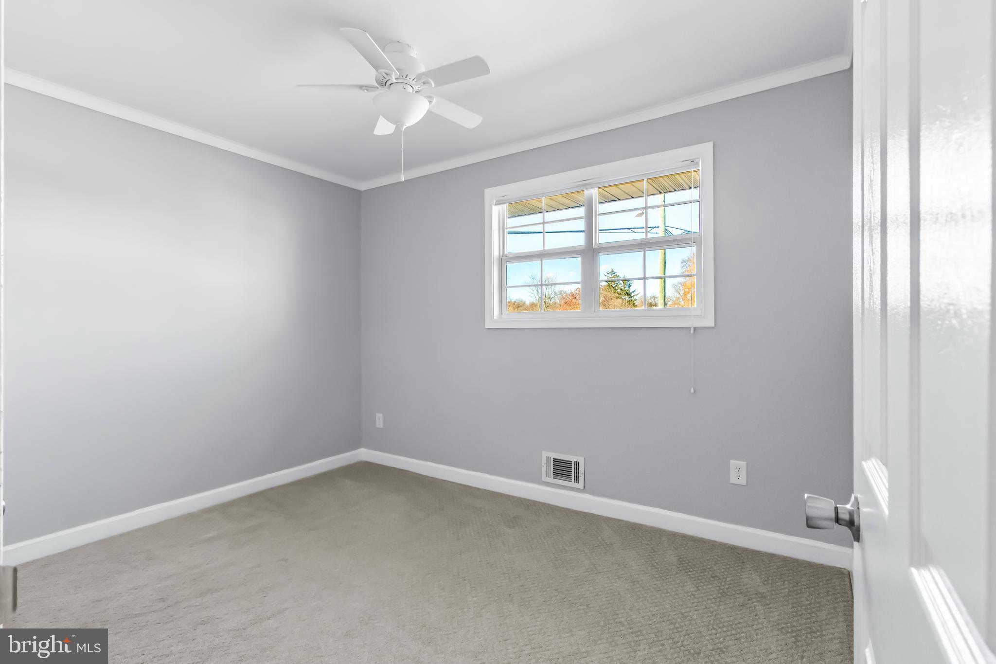 1000 8th Street Laurel, MD 20707 - Photo 12 of 45 an empty room with a window