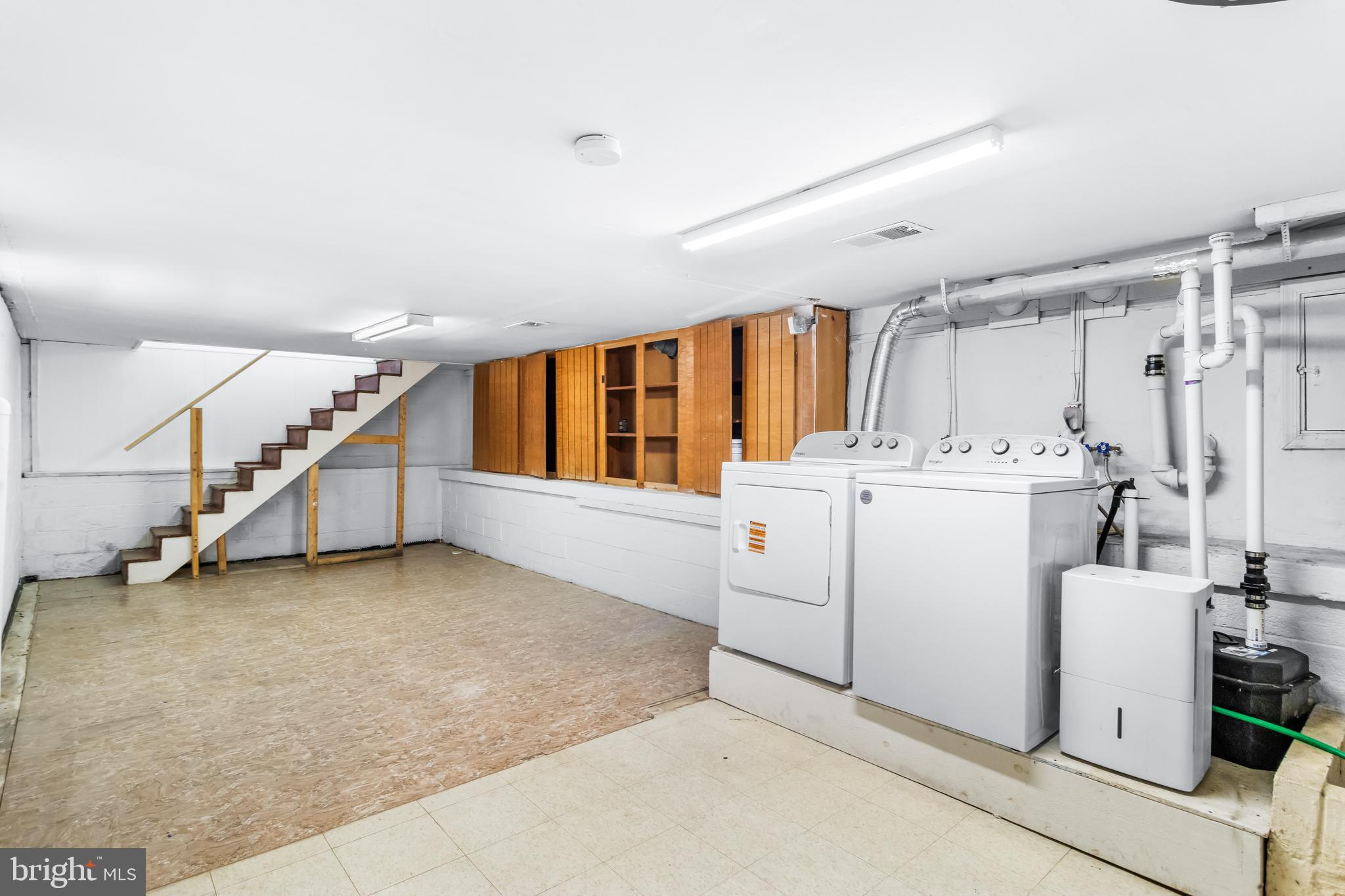 1000 8th Street Laurel, MD 20707 - Photo 18 of 45 a storage room with washer and dryer