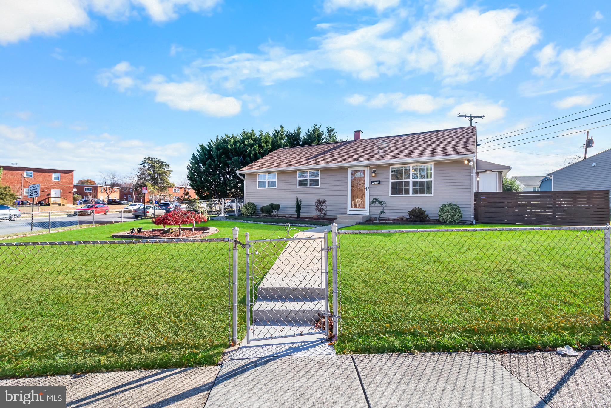 1000 8th Street Laurel, MD 20707 - Photo 2 of 45 a front view of a house with garden