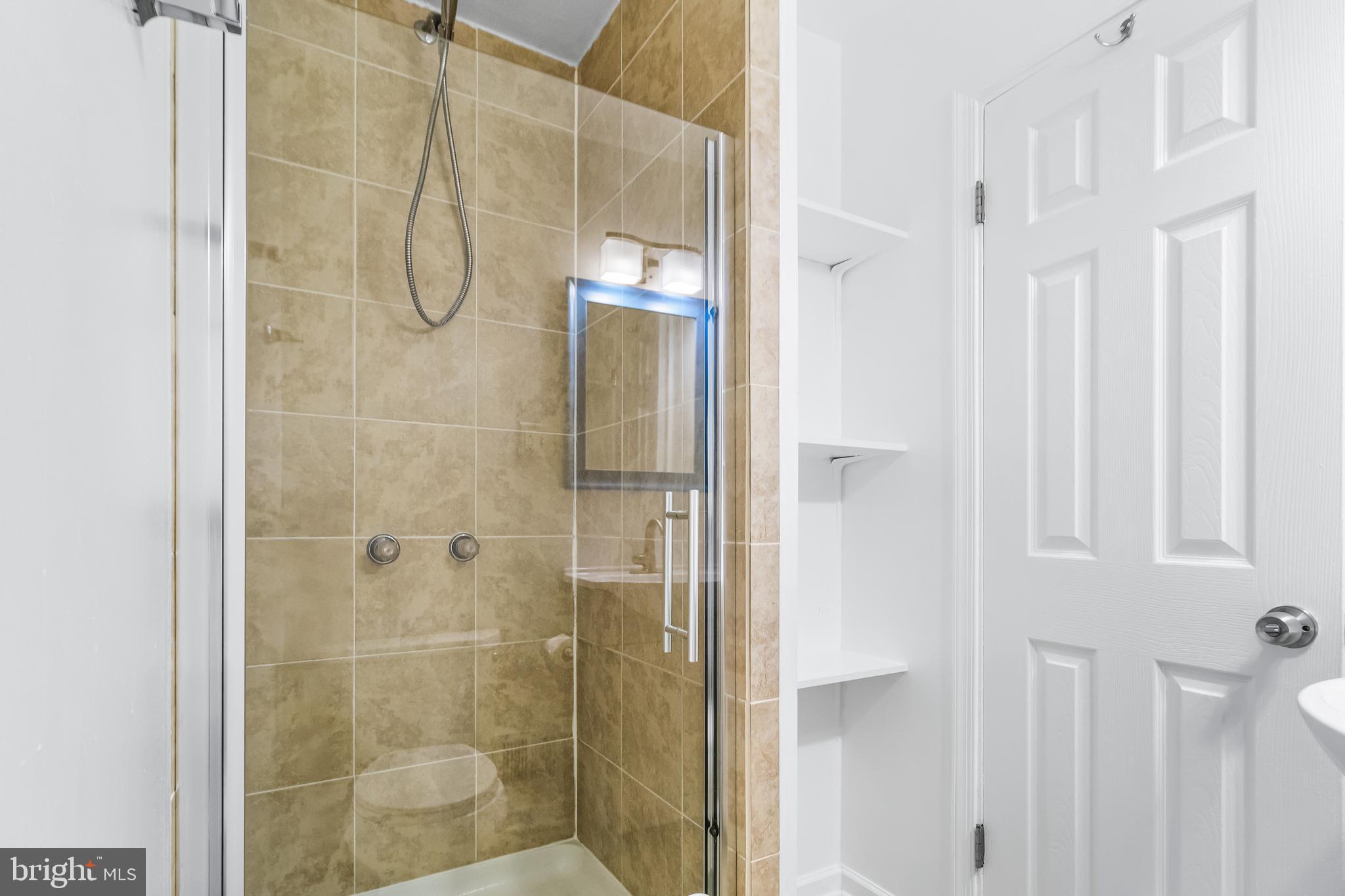 1000 8th Street Laurel, MD 20707 - Photo 22 of 45 a bathroom with a shower