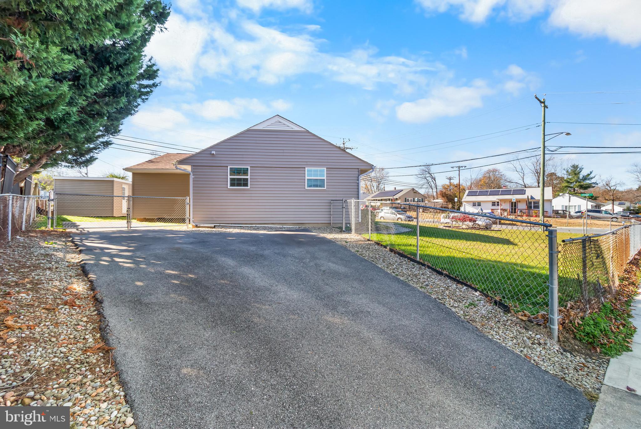 1000 8th Street Laurel, MD 20707 - Photo 3 of 45 a view of a house with a big yard and large trees
