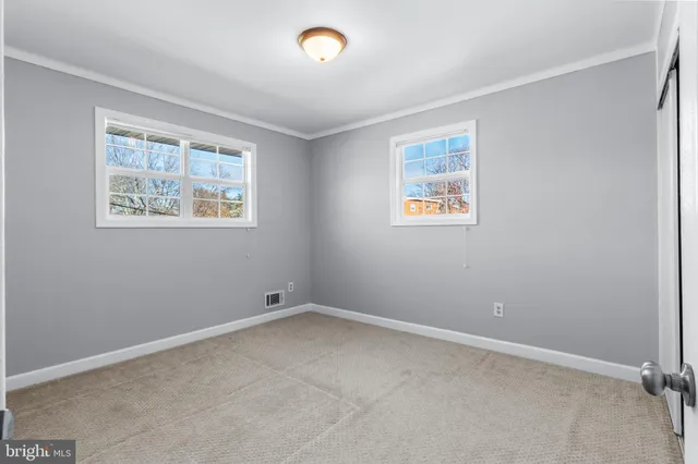 a front view of a garden with fountain