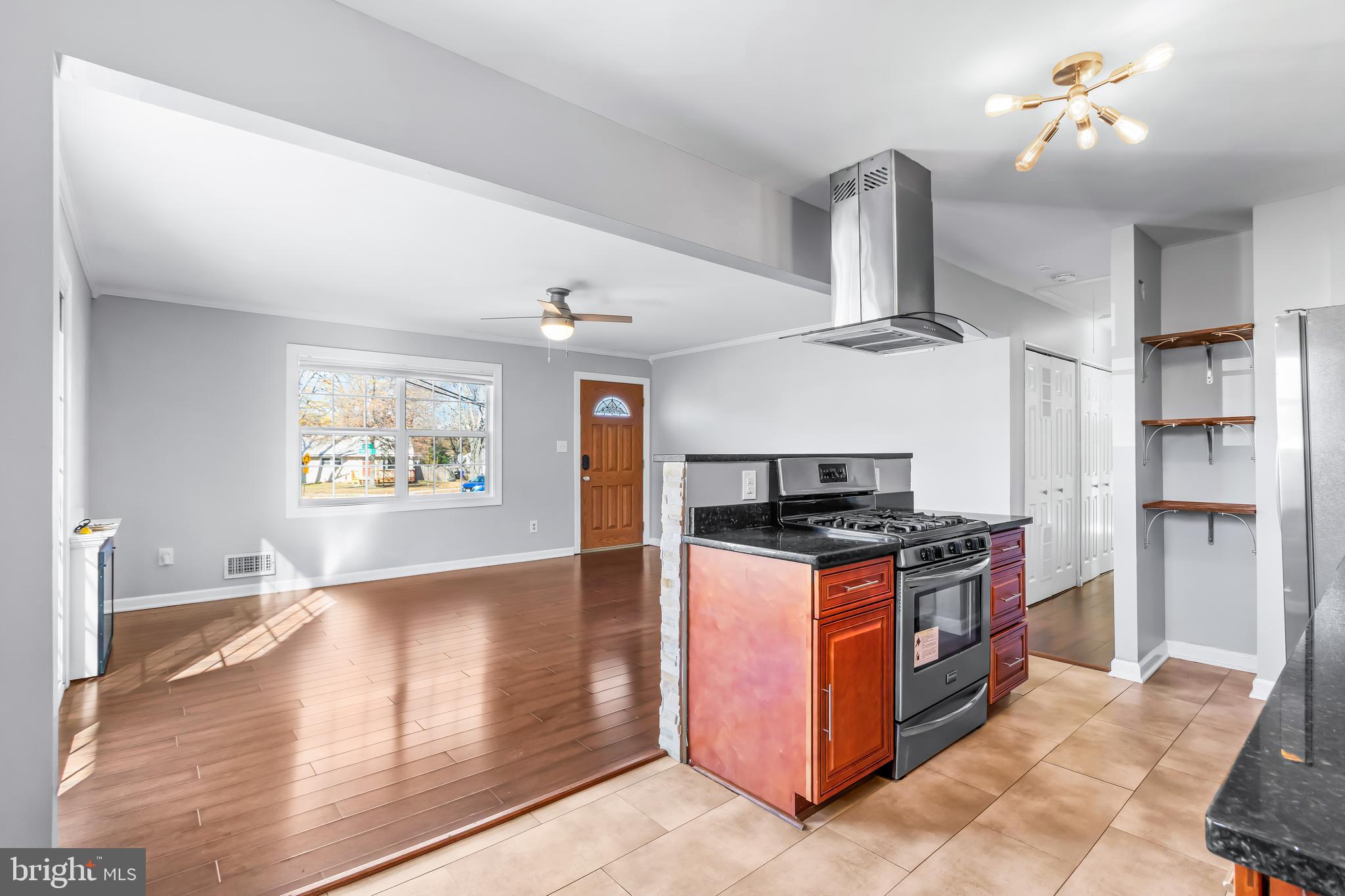 1000 8th Street Laurel, MD 20707 - Photo 7 of 45 a kitchen with stainless steel appliances granite countertop a stove and a refrigerator
