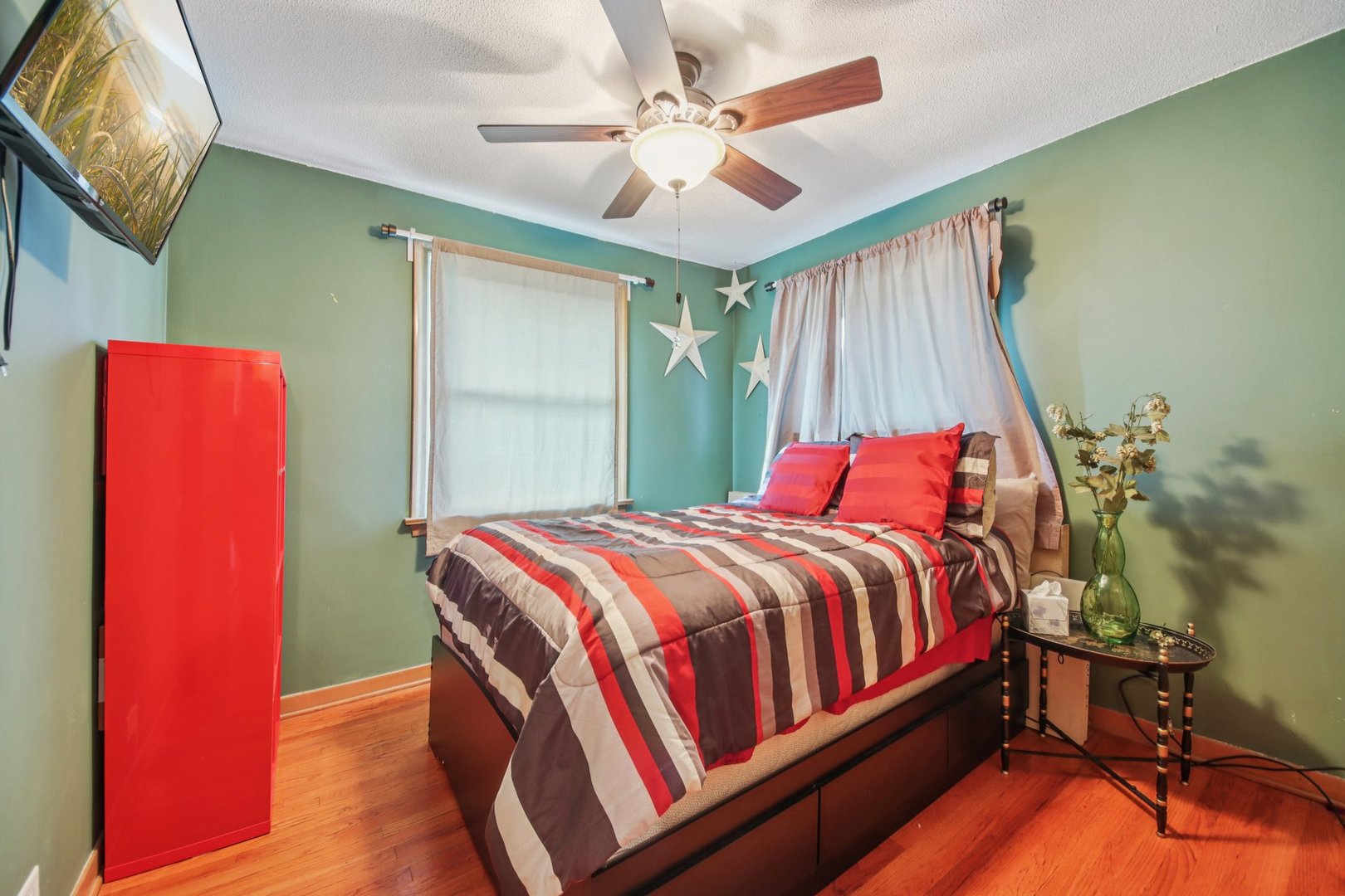 4604 Maple Avenue Forest View, IL 60402 - Photo 12 of 35 a bedroom with a bed and a chandelier