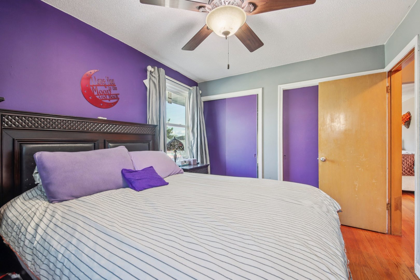 4604 Maple Avenue Forest View, IL 60402 - Photo 15 of 35 a bedroom with a bed and a chandelier