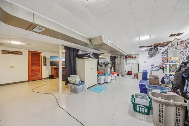 a living room with lots of furniture and gym equipment