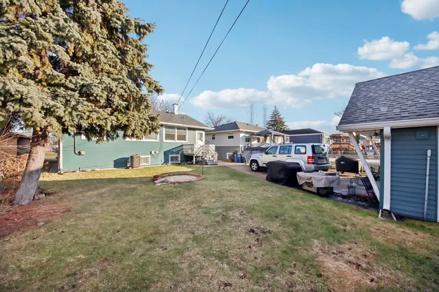 a view of a yard with cars