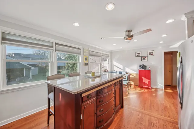 a kitchen with stainless steel appliances granite countertop a sink and a stove