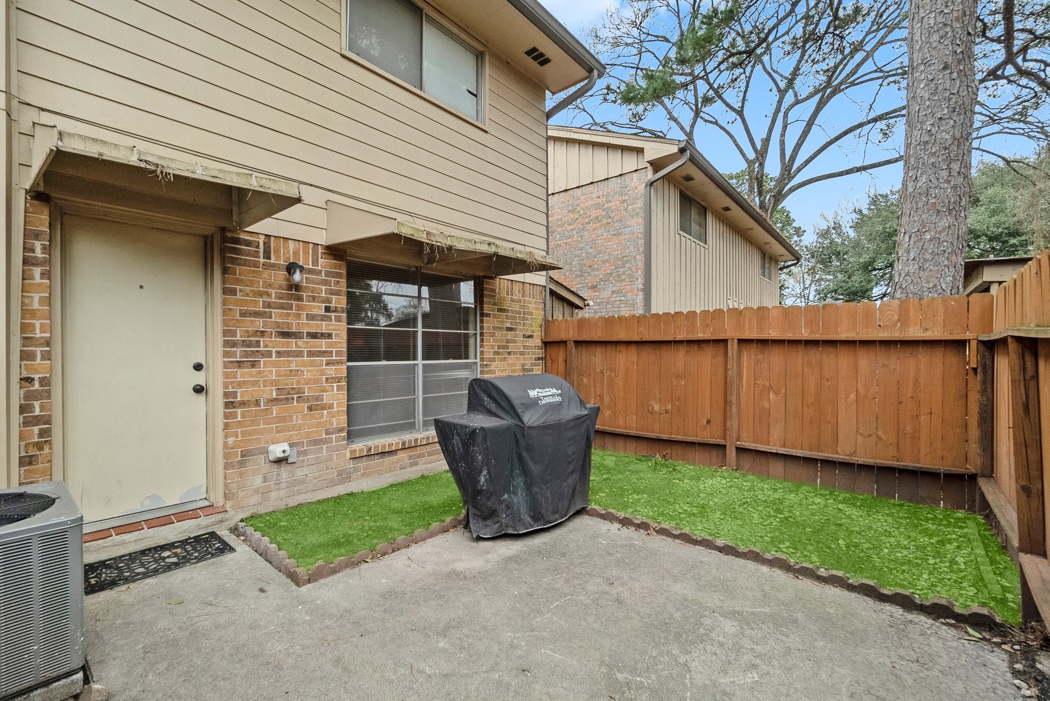 407 West Semands Street Conroe, TX 77301 - Photo 9 of 28 a view of a backyard with plants and a tub