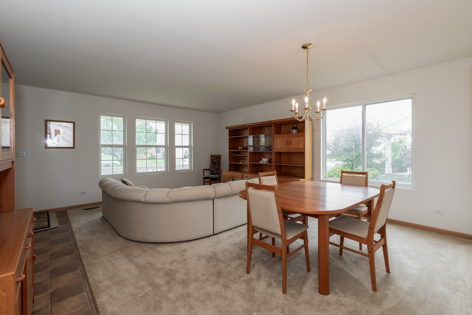 1143 Port Royal Road Pingree Grove, IL 60140 - Photo 3 of 13 a living room with furniture a window and a table