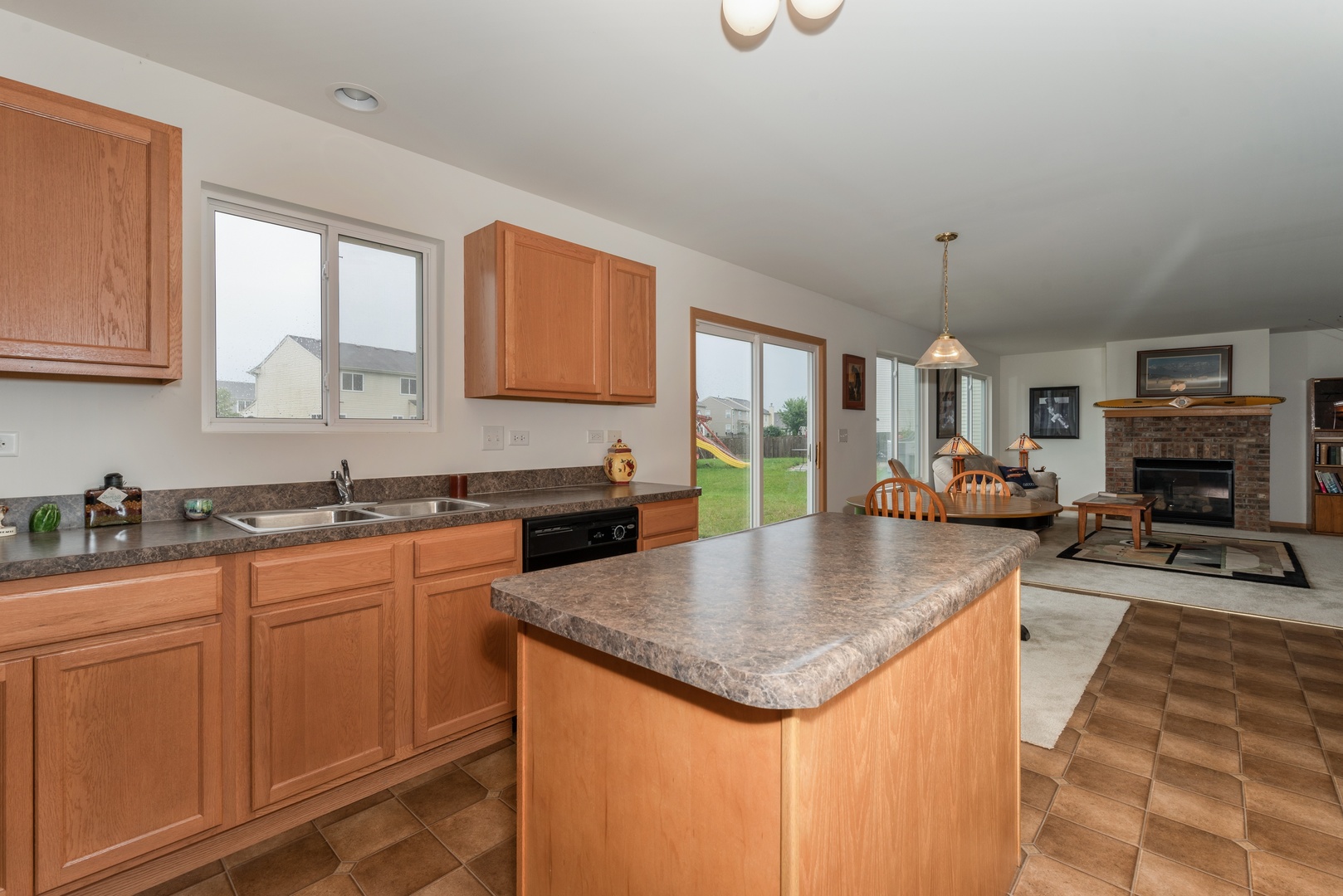 1143 Port Royal Road Pingree Grove, IL 60140 - Photo 5 of 13 a kitchen with granite countertop a sink and a stove top oven