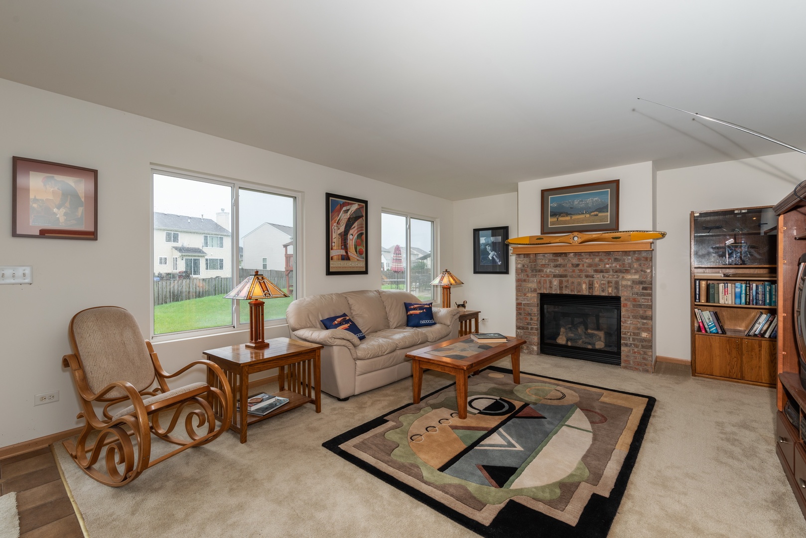 1143 Port Royal Road Pingree Grove, IL 60140 - Photo 6 of 13 a living room with furniture and a fireplace