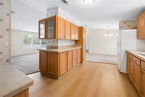 a kitchen with stainless steel appliances granite countertop a stove and a refrigerator
