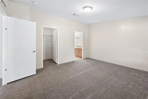 an empty room with closet area