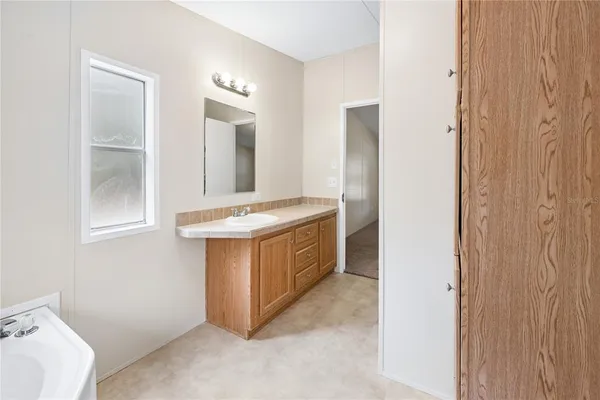 a bathroom with a glass shower door