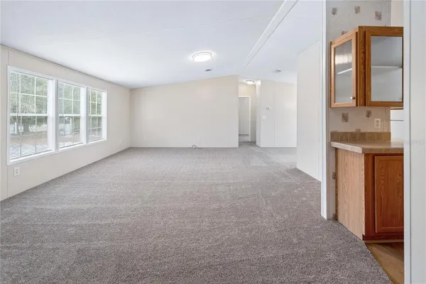 a view of a hallway with a room