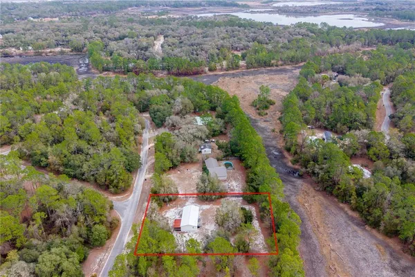 an aerial view of residential house with outdoor space
