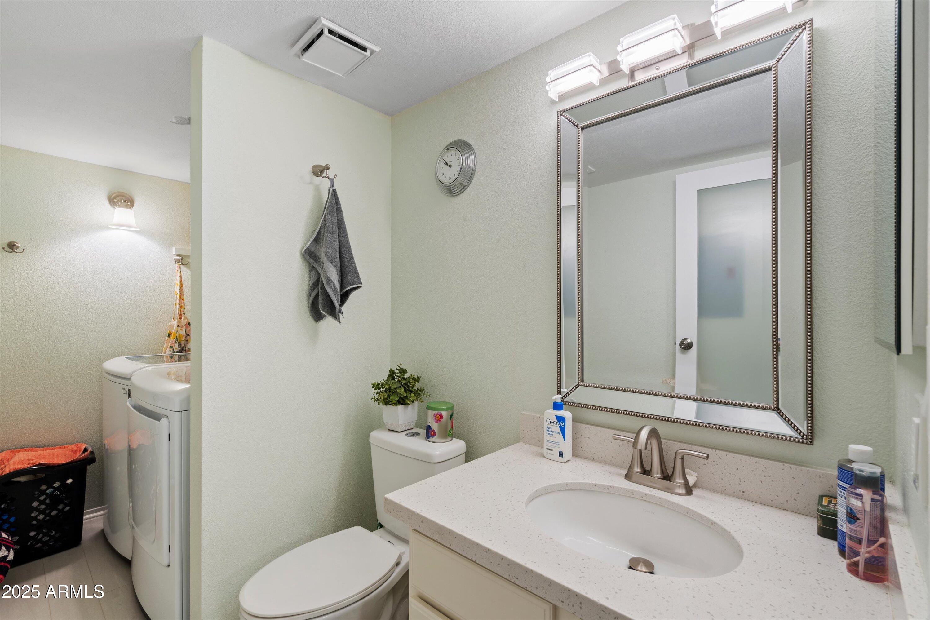 3511 East Baseline Road, Unit 1243 Phoenix, AZ 85042 - Photo 12 of 31 13-Powder Room and Laundry Room