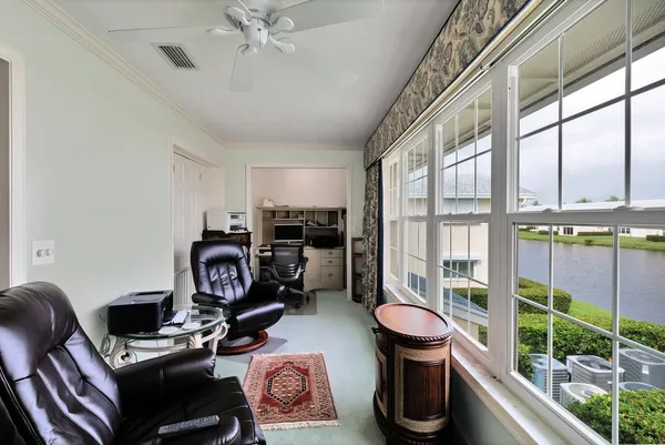 a work room with furniture and rug floor