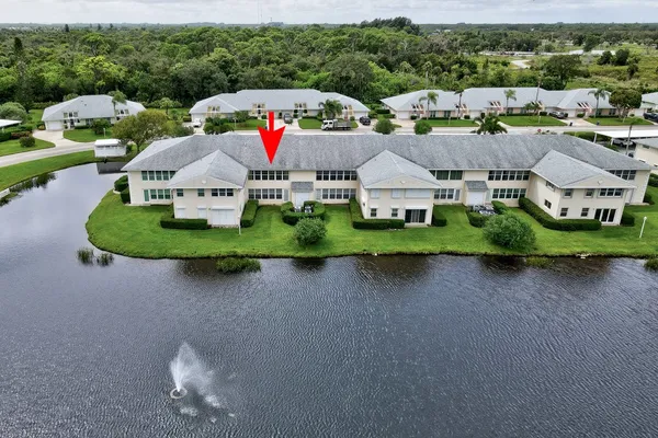 a aerial view of a house with swimming pool and outdoor space