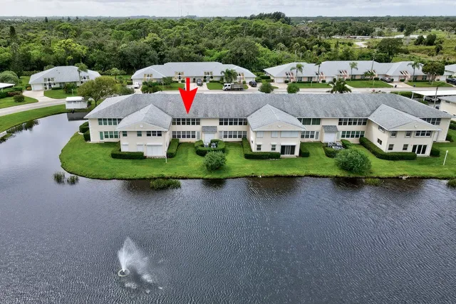 a aerial view of a house with swimming pool and outdoor space