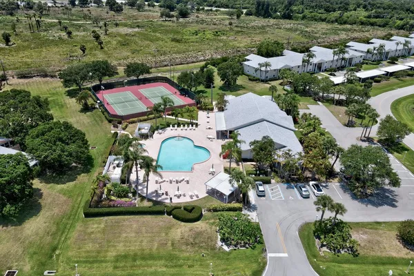 an aerial view of a house with outdoor space swimming pool and lake view