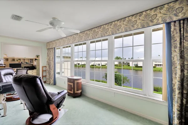 a room with workspace and a window