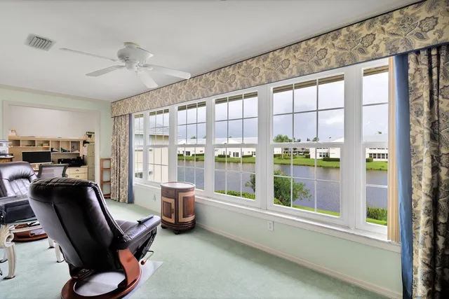 a room with workspace and a window