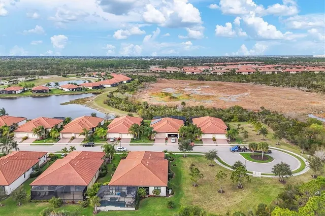 a kitchen with granite countertop a sink stove and cabinets
