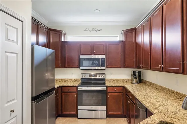 a bathroom with a sink a toilet and shower curtain