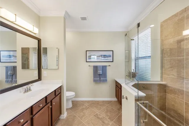 a view of a patio with couches table and chairs and potted plants