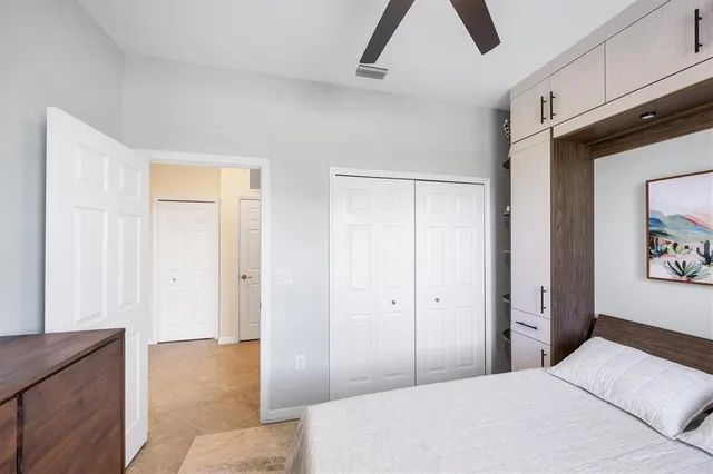 a view of a livingroom with furniture and a bookshelf