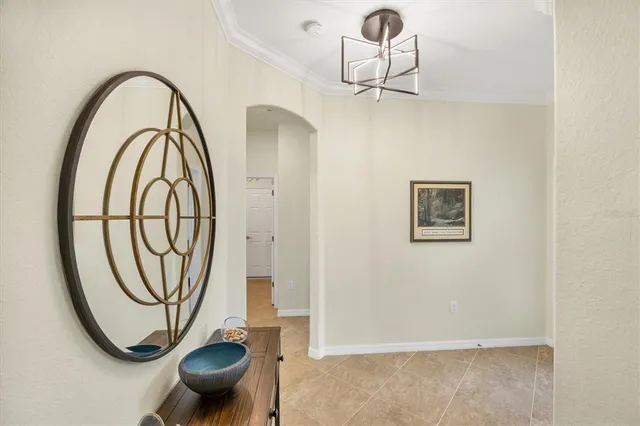 a tennis court with lots of trees in the background