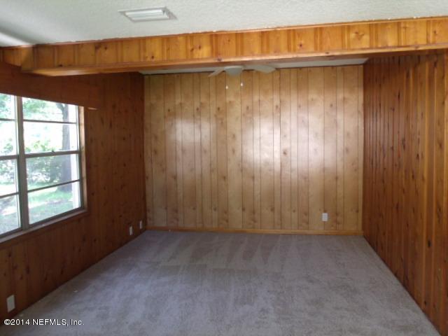 2516 Bayview Road Jacksonville, FL 32210 - Photo 3 of 8 an empty room with windows