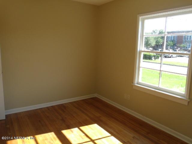 2516 Bayview Road Jacksonville, FL 32210 - Photo 5 of 8 a view of a small space with wooden floor and a window