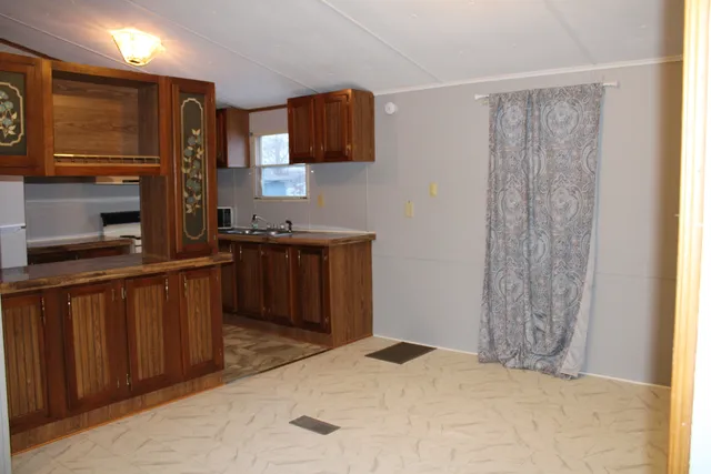 a kitchen with stainless steel appliances a refrigerator and a sink