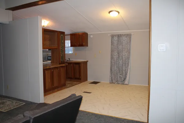 a view of kitchen with furniture and wooden floor