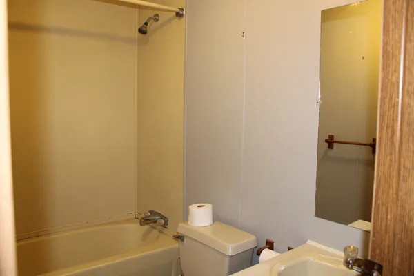 a bathroom with a sink and shower