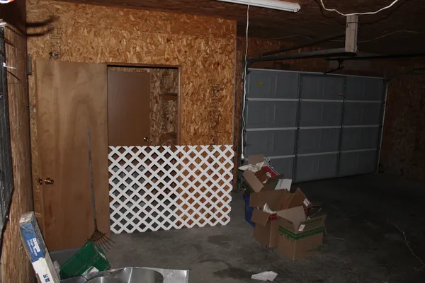 a view of a house with backyard and garden