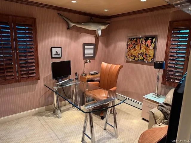 a view of a livingroom with workspace and a couch