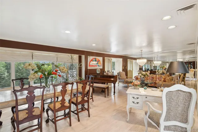 a view of a dining room with furniture window and outside view
