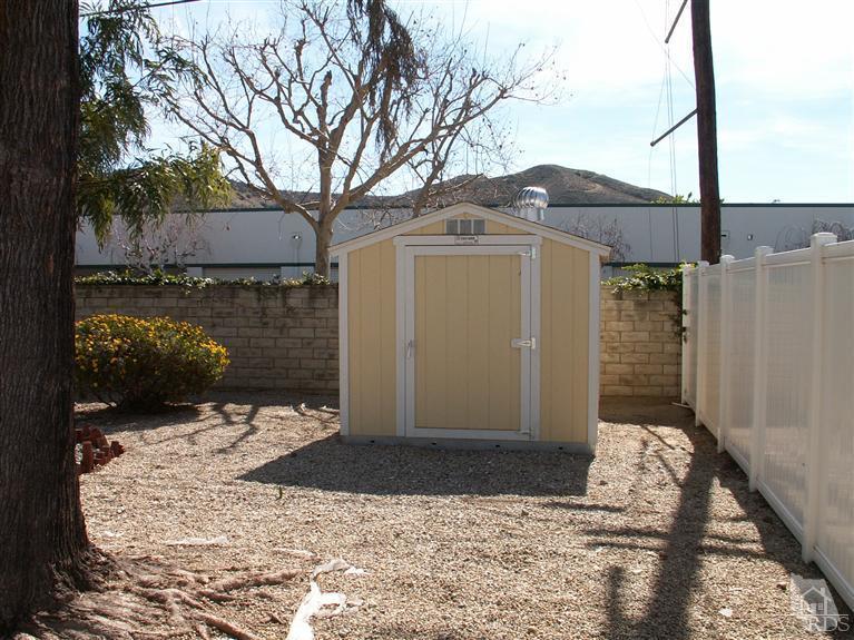 4512 Alpine Street Simi Valley, CA 93063 - Photo 5 of 11 a front view of a house with a yard