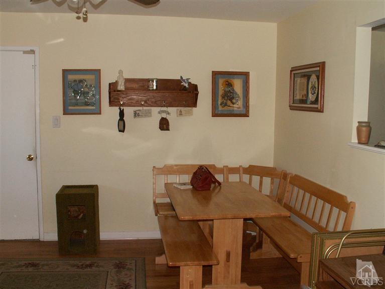 4512 Alpine Street Simi Valley, CA 93063 - Photo 9 of 11 a view of a workspace with furniture and wooden floor