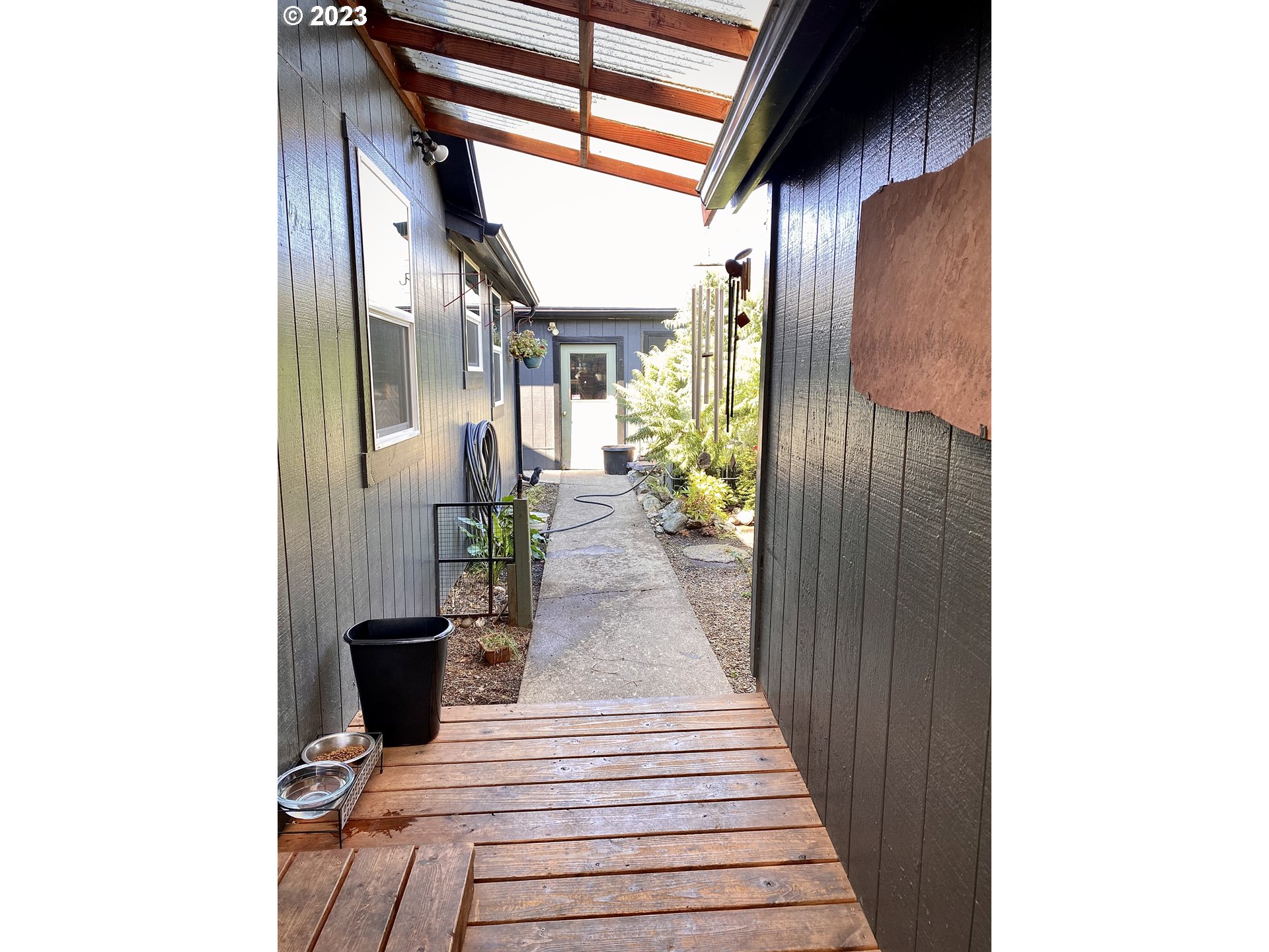 1344 S Street Springfield, OR 97477 - Photo 23 of 30 a view of a patio with table and chairs and potted plants