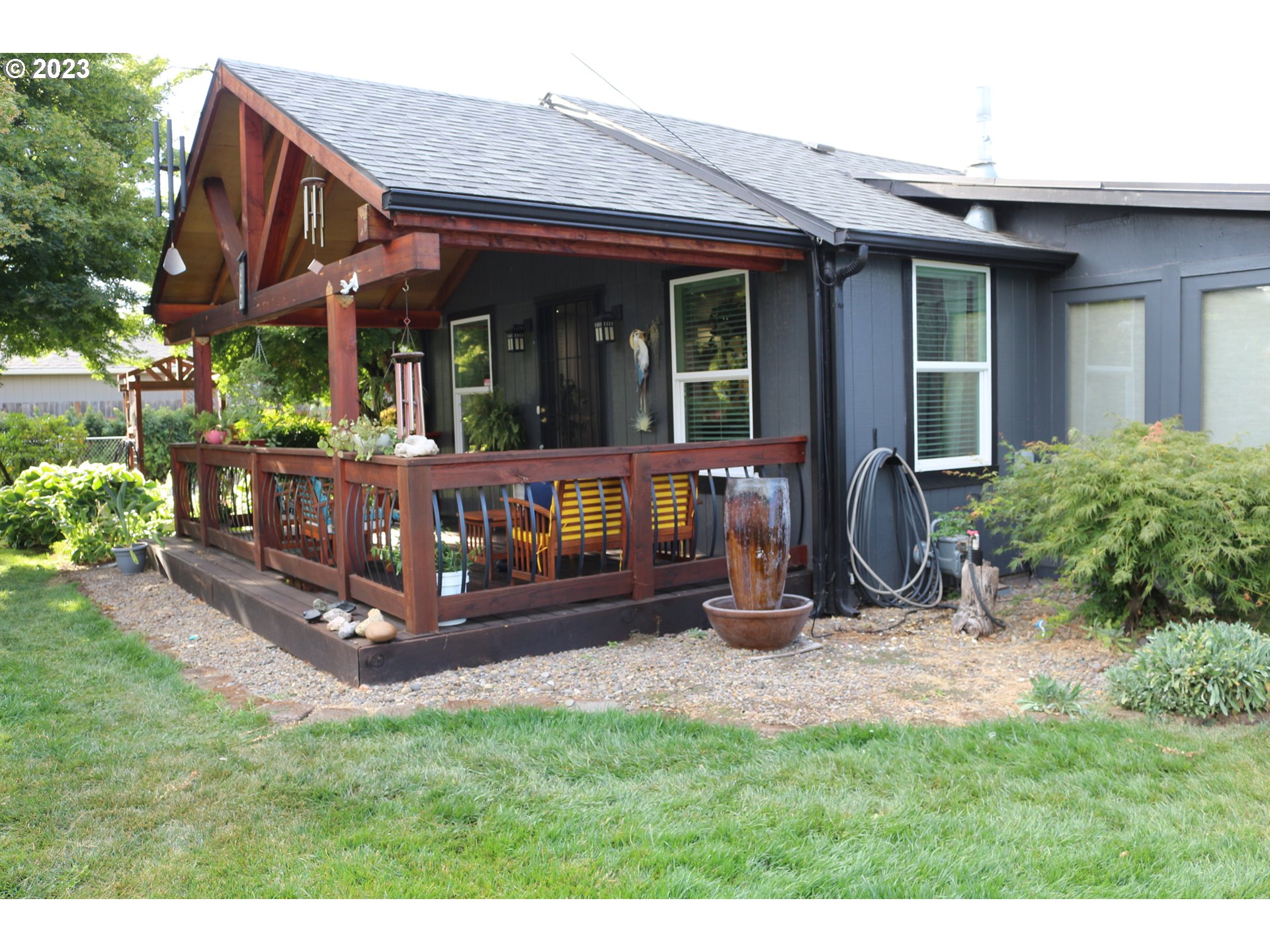 1344 S Street Springfield, OR 97477 - Photo 5 of 30 a view of a house with a yard and sitting area