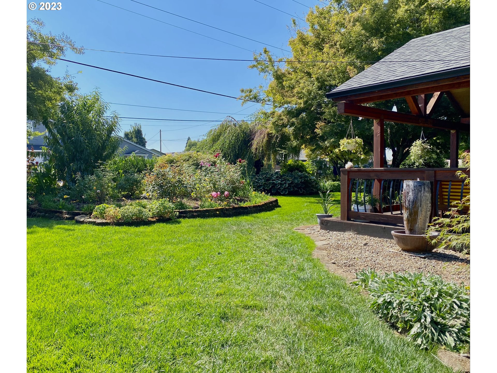 1344 S Street Springfield, OR 97477 - Photo 7 of 30 a view of a chair and table in backyard of the house