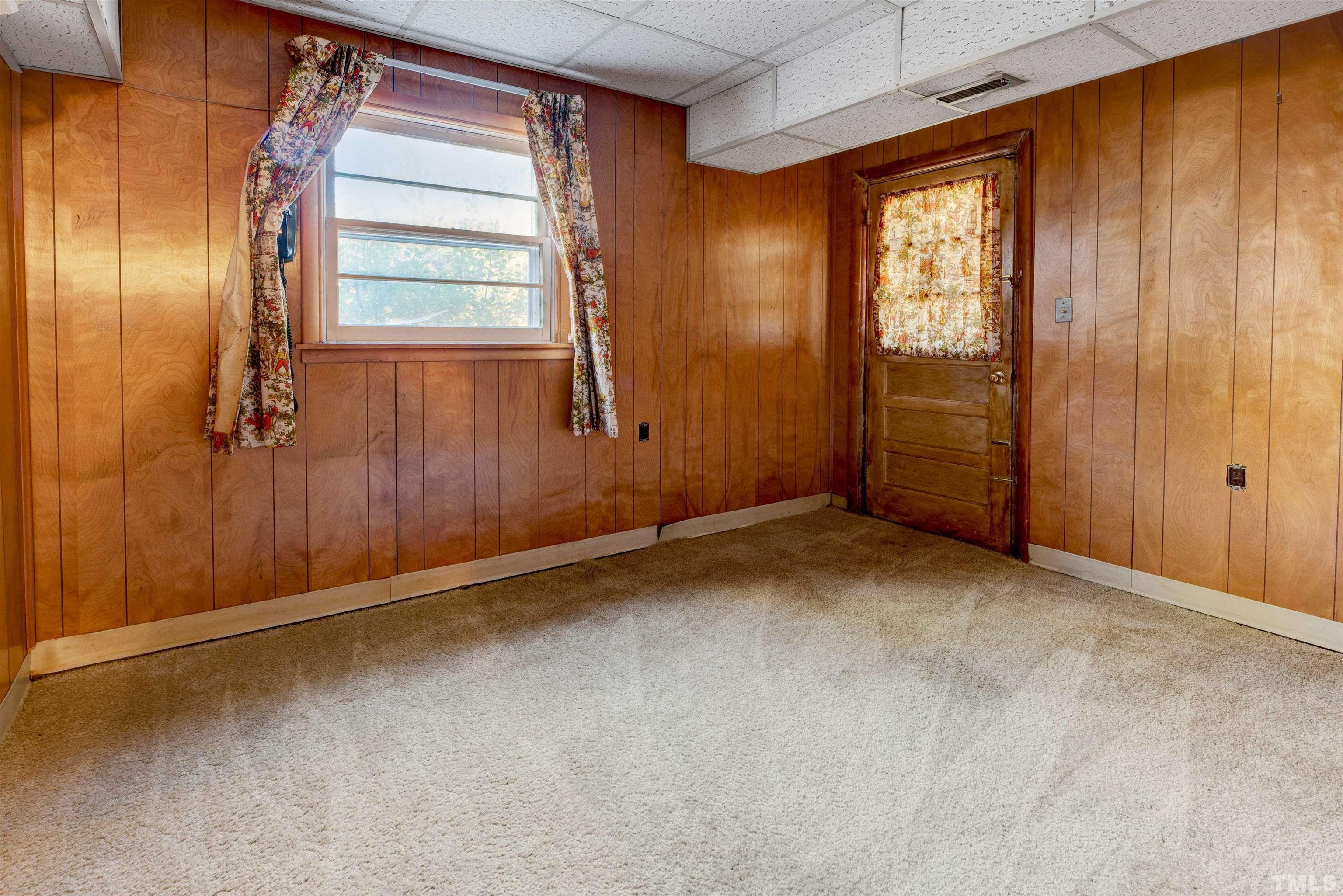 1807 Euclid Road Durham, NC 27713 - Photo 16 of 19 an empty room with windows